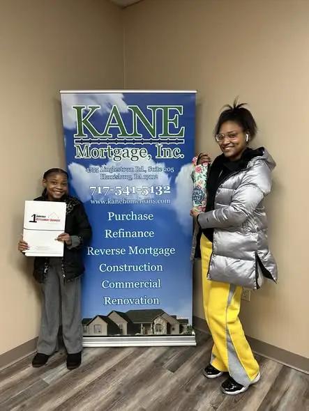 A family is all smiles at Kane Mortgage, Inc.